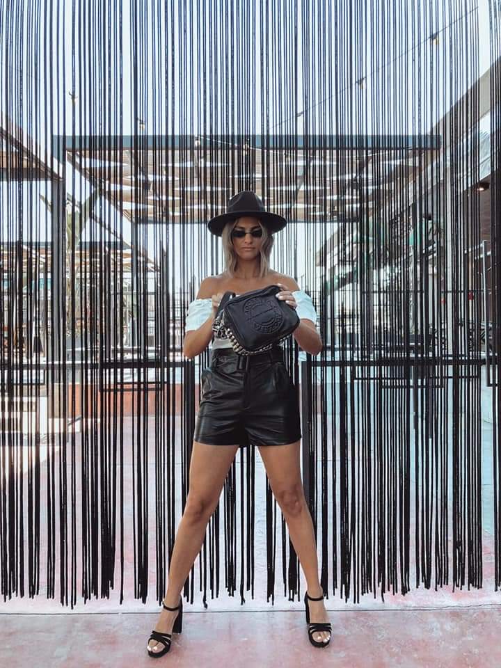 Editorial — black leather bag